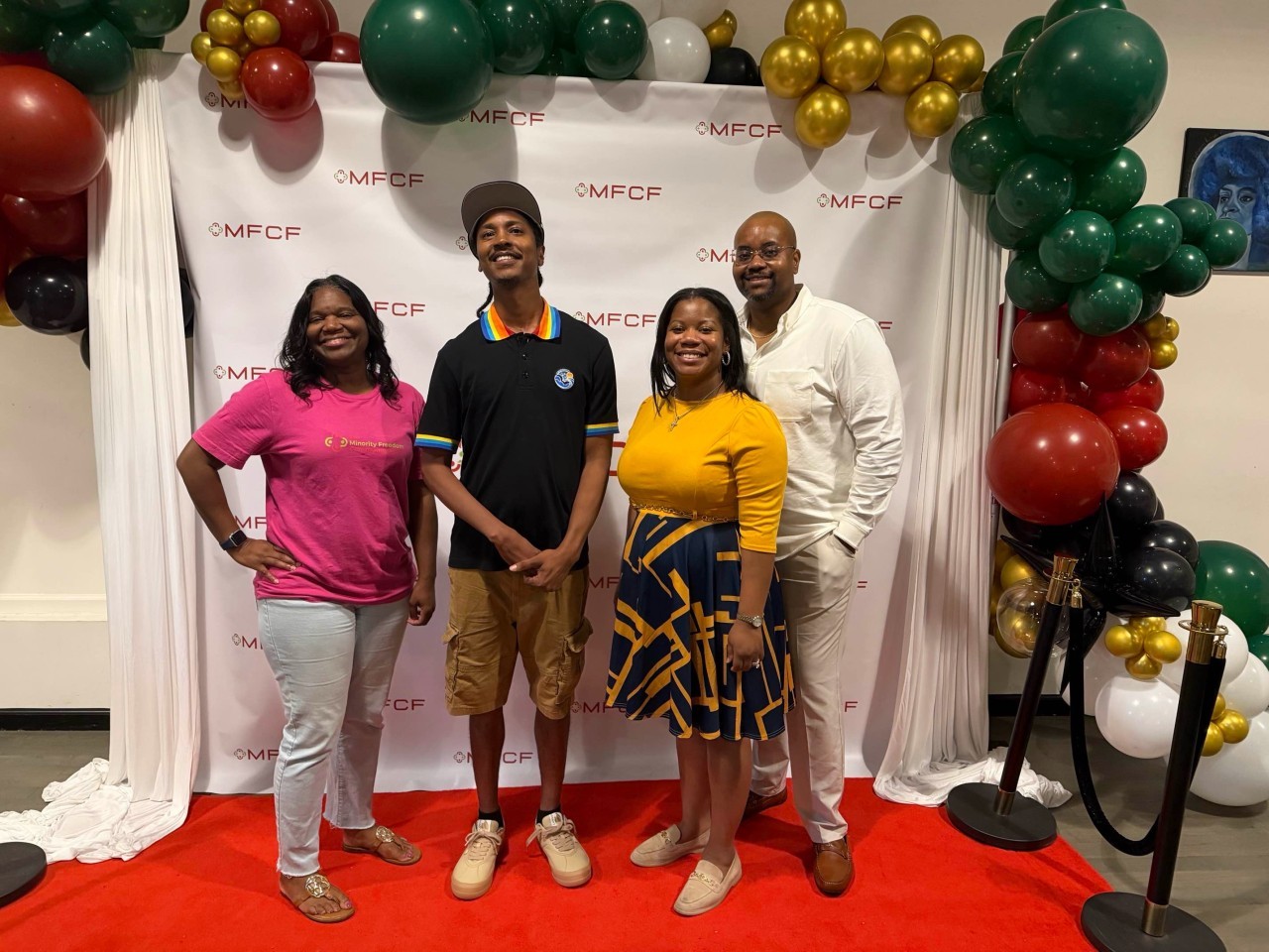 DeVante with fellow attendees at a community event